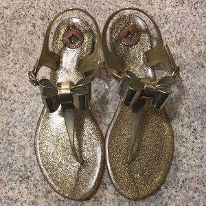 Golden sandals with bow